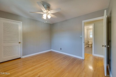 Welcome home to this one level brick beauty with a basement! on Johnson City Country Club in Tennessee - for sale on GolfHomes.com, golf home, golf lot