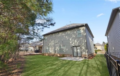 Discover the perfect blend of elegance and comfort in this on Canongate At Heron Bay in Georgia - for sale on GolfHomes.com, golf home, golf lot