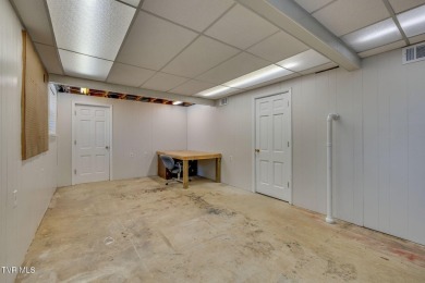 Welcome home to this one level brick beauty with a basement! on Johnson City Country Club in Tennessee - for sale on GolfHomes.com, golf home, golf lot