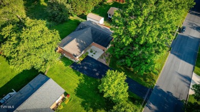 Welcome home to this one level brick beauty with a basement! on Johnson City Country Club in Tennessee - for sale on GolfHomes.com, golf home, golf lot
