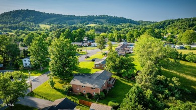 Welcome home to this one level brick beauty with a basement! on Johnson City Country Club in Tennessee - for sale on GolfHomes.com, golf home, golf lot