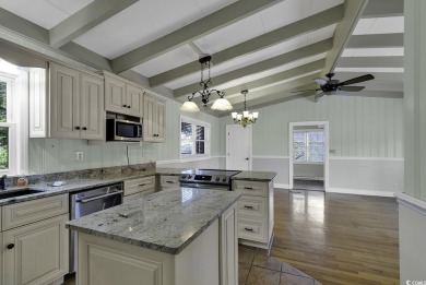 Nestled in the heart of Cherry Grove Beach, this charming home on Surf Golf and Beach Club in South Carolina - for sale on GolfHomes.com, golf home, golf lot