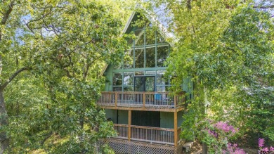 This charming tucked away A-Frame style house is located in the on Hide-A-Way Lake Golf Course in Texas - for sale on GolfHomes.com, golf home, golf lot