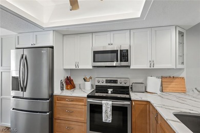 Enjoy peaceful golf course and lake views from this first floor on Breckenridge Golf and Country Club in Florida - for sale on GolfHomes.com, golf home, golf lot