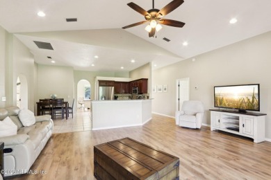 Stunning home with pond view in the sought-after Eagle Harbor on Eagle Harbor Golf Club in Florida - for sale on GolfHomes.com, golf home, golf lot