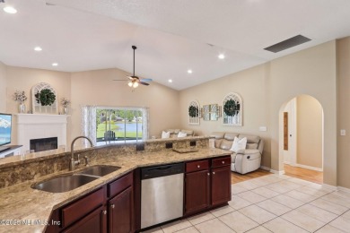 Stunning home with pond view in the sought-after Eagle Harbor on Eagle Harbor Golf Club in Florida - for sale on GolfHomes.com, golf home, golf lot