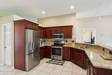 Stunning home with pond view in the sought-after Eagle Harbor on Eagle Harbor Golf Club in Florida - for sale on GolfHomes.com, golf home, golf lot