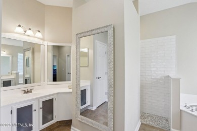 Stunning home with pond view in the sought-after Eagle Harbor on Eagle Harbor Golf Club in Florida - for sale on GolfHomes.com, golf home, golf lot