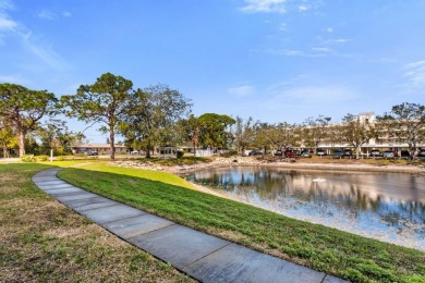 Totally renovated first floor unit.  Enjoy your lanai and pond on Pinebrook/Ironwood Golf Course in Florida - for sale on GolfHomes.com, golf home, golf lot