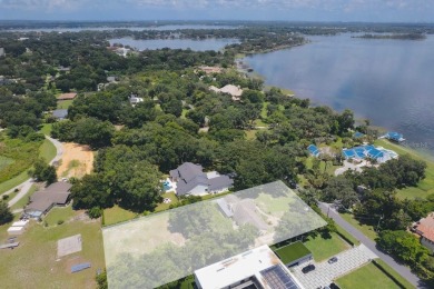 Nestled on one of Windermere's most desirable streets, this on Windermere Country Club in Florida - for sale on GolfHomes.com, golf home, golf lot