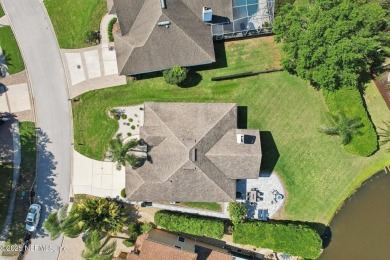 Stunning home with pond view in the sought-after Eagle Harbor on Eagle Harbor Golf Club in Florida - for sale on GolfHomes.com, golf home, golf lot