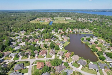 Stunning home with pond view in the sought-after Eagle Harbor on Eagle Harbor Golf Club in Florida - for sale on GolfHomes.com, golf home, golf lot