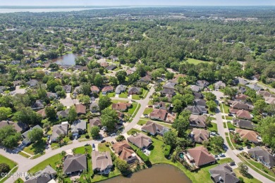 Stunning home with pond view in the sought-after Eagle Harbor on Eagle Harbor Golf Club in Florida - for sale on GolfHomes.com, golf home, golf lot