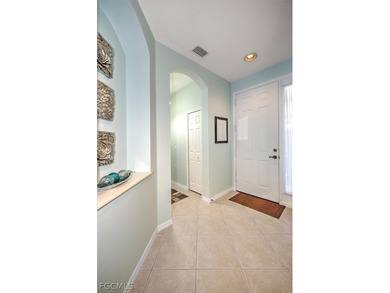 A gracious home set on golf course lot in Avila at Pelican on Pelican Preserve Golf Club in Florida - for sale on GolfHomes.com, golf home, golf lot