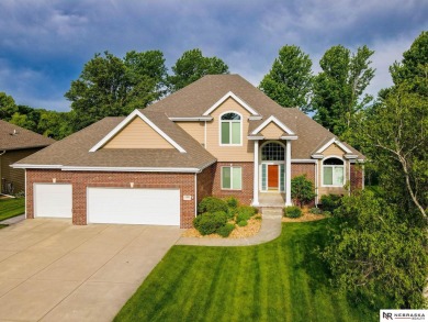 This stunning 5 bedroom home is nestled on a treed golf course on Woodland Hills Golf Course in Nebraska - for sale on GolfHomes.com, golf home, golf lot