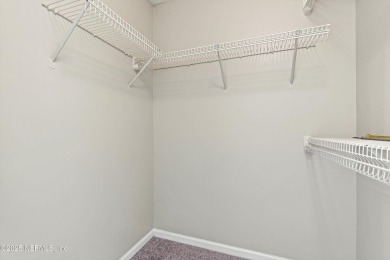 This charming one-story townhome offers easy living in the on Hidden Hills Country Club in Florida - for sale on GolfHomes.com, golf home, golf lot