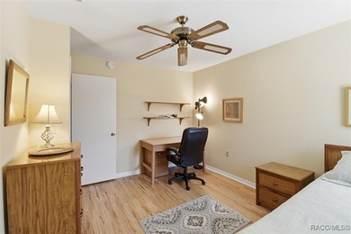 This Greenbriar upstairs unit offers a serene living experience on Citrus Hills Golf Club in Florida - for sale on GolfHomes.com, golf home, golf lot