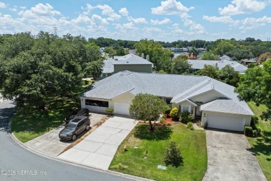 This charming one-story townhome offers easy living in the on Hidden Hills Country Club in Florida - for sale on GolfHomes.com, golf home, golf lot