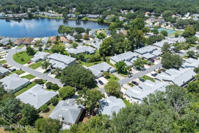 This charming one-story townhome offers easy living in the on Hidden Hills Country Club in Florida - for sale on GolfHomes.com, golf home, golf lot