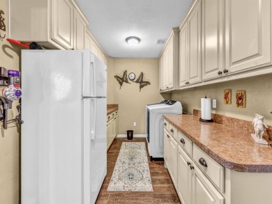 Welcome to 6100 Cherokee Dr, a warm and inviting retreat nestled on Pecan Plantation Country Club in Texas - for sale on GolfHomes.com, golf home, golf lot