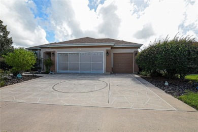 Discover your dream home in this exquisite 1936 sq. ft. Sanibel on Eagle Ridge At Spruce Creek Country Club in Florida - for sale on GolfHomes.com, golf home, golf lot