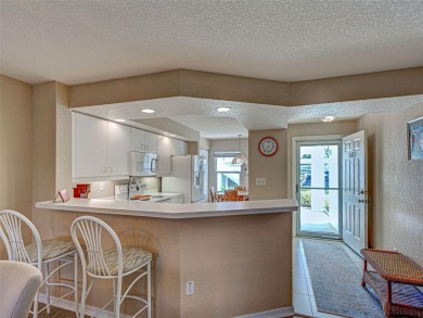 Enjoy peaceful canal views and Florida living at its finest in on Sabal Trace Golf and Country Club in Florida - for sale on GolfHomes.com, golf home, golf lot