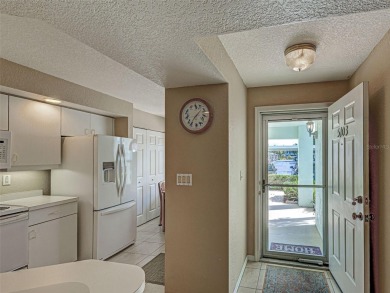Enjoy peaceful canal views and Florida living at its finest in on Sabal Trace Golf and Country Club in Florida - for sale on GolfHomes.com, golf home, golf lot