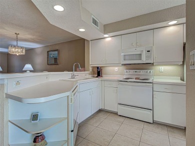 Enjoy peaceful canal views and Florida living at its finest in on Sabal Trace Golf and Country Club in Florida - for sale on GolfHomes.com, golf home, golf lot