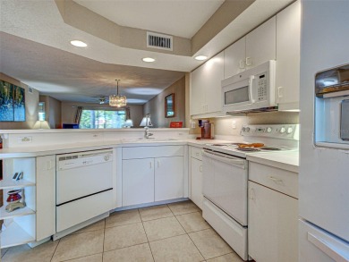 Enjoy peaceful canal views and Florida living at its finest in on Sabal Trace Golf and Country Club in Florida - for sale on GolfHomes.com, golf home, golf lot
