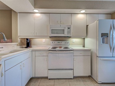 Enjoy peaceful canal views and Florida living at its finest in on Sabal Trace Golf and Country Club in Florida - for sale on GolfHomes.com, golf home, golf lot