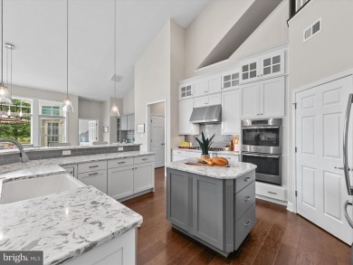 The welcoming covered entry of 33437 Islander Drive invites you on The Peninsula Golf and Country Club in Delaware - for sale on GolfHomes.com, golf home, golf lot