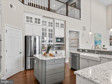 The welcoming covered entry of 33437 Islander Drive invites you on The Peninsula Golf and Country Club in Delaware - for sale on GolfHomes.com, golf home, golf lot
