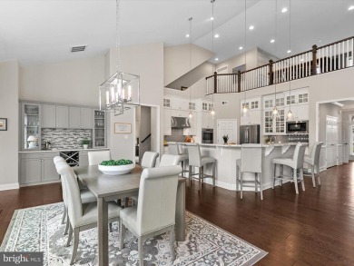 The welcoming covered entry of 33437 Islander Drive invites you on The Peninsula Golf and Country Club in Delaware - for sale on GolfHomes.com, golf home, golf lot