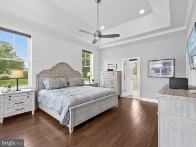 The welcoming covered entry of 33437 Islander Drive invites you on The Peninsula Golf and Country Club in Delaware - for sale on GolfHomes.com, golf home, golf lot