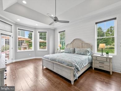 The welcoming covered entry of 33437 Islander Drive invites you on The Peninsula Golf and Country Club in Delaware - for sale on GolfHomes.com, golf home, golf lot