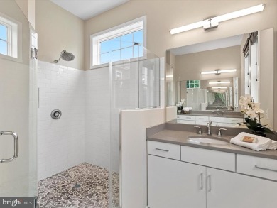 The welcoming covered entry of 33437 Islander Drive invites you on The Peninsula Golf and Country Club in Delaware - for sale on GolfHomes.com, golf home, golf lot