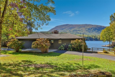Welcome to an extraordinary lakefront estate on Lake Toxaway on Lake Toxaway Country Club in North Carolina - for sale on GolfHomes.com, golf home, golf lot