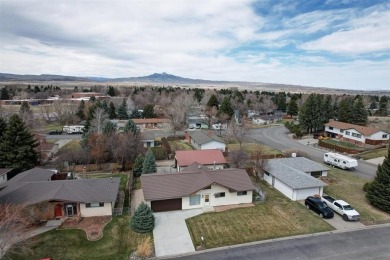 Welcome to this bright  inviting 4-bedroom, 3-bathroom home on Olive Glenn Golf and Country Club in Wyoming - for sale on GolfHomes.com, golf home, golf lot