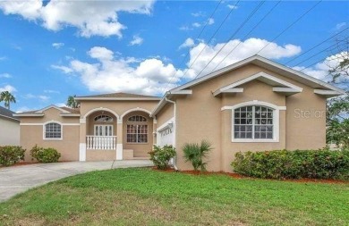 Move-in ready pool home in Long Bayou Estates! This on Seminole Lake Country Club in Florida - for sale on GolfHomes.com, golf home, golf lot