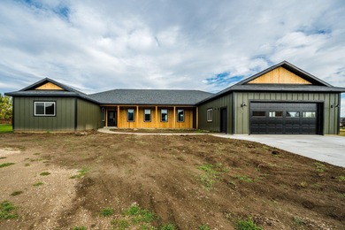 This beautiful new home in the Powder Horn Golf Community offers on The Powder Horn Golf Club - Mountain in Wyoming - for sale on GolfHomes.com, golf home, golf lot