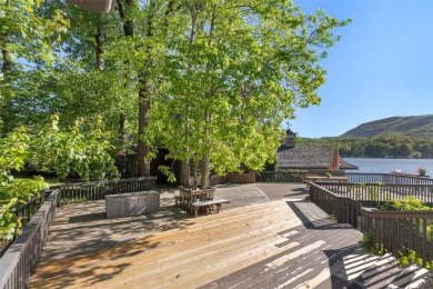 Welcome to an extraordinary lakefront estate on Lake Toxaway on Lake Toxaway Country Club in North Carolina - for sale on GolfHomes.com, golf home, golf lot