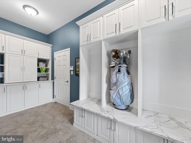 The welcoming covered entry of 33437 Islander Drive invites you on The Peninsula Golf and Country Club in Delaware - for sale on GolfHomes.com, golf home, golf lot