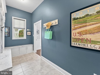 The welcoming covered entry of 33437 Islander Drive invites you on The Peninsula Golf and Country Club in Delaware - for sale on GolfHomes.com, golf home, golf lot