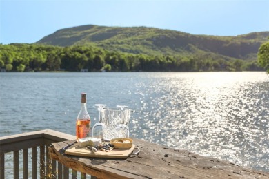 Welcome to an extraordinary lakefront estate on Lake Toxaway on Lake Toxaway Country Club in North Carolina - for sale on GolfHomes.com, golf home, golf lot