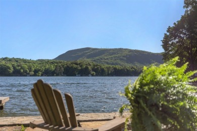 Welcome to an extraordinary lakefront estate on Lake Toxaway on Lake Toxaway Country Club in North Carolina - for sale on GolfHomes.com, golf home, golf lot