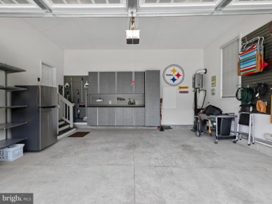 The welcoming covered entry of 33437 Islander Drive invites you on The Peninsula Golf and Country Club in Delaware - for sale on GolfHomes.com, golf home, golf lot