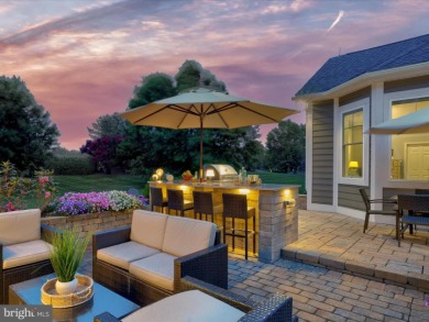 The welcoming covered entry of 33437 Islander Drive invites you on The Peninsula Golf and Country Club in Delaware - for sale on GolfHomes.com, golf home, golf lot