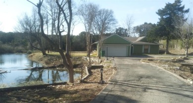 Beautifully unique 4 bedroom 2 bath home with ponds on the on Lake Whitney Country Club in Texas - for sale on GolfHomes.com, golf home, golf lot