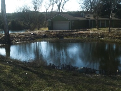 Beautifully unique 4 bedroom 2 bath home with ponds on the on Lake Whitney Country Club in Texas - for sale on GolfHomes.com, golf home, golf lot