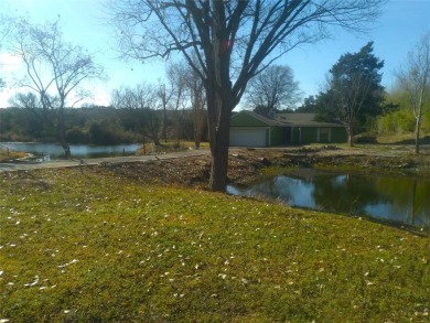 Beautifully unique 4 bedroom 2 bath home with ponds on the on Lake Whitney Country Club in Texas - for sale on GolfHomes.com, golf home, golf lot